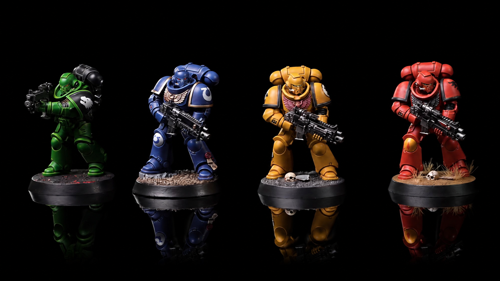 Fyra modeller målade i grönt, blått, gult och rött med Warhammer Tone Pro